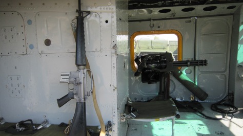 Inside the Huey - My M-16 and the minigun attached.
